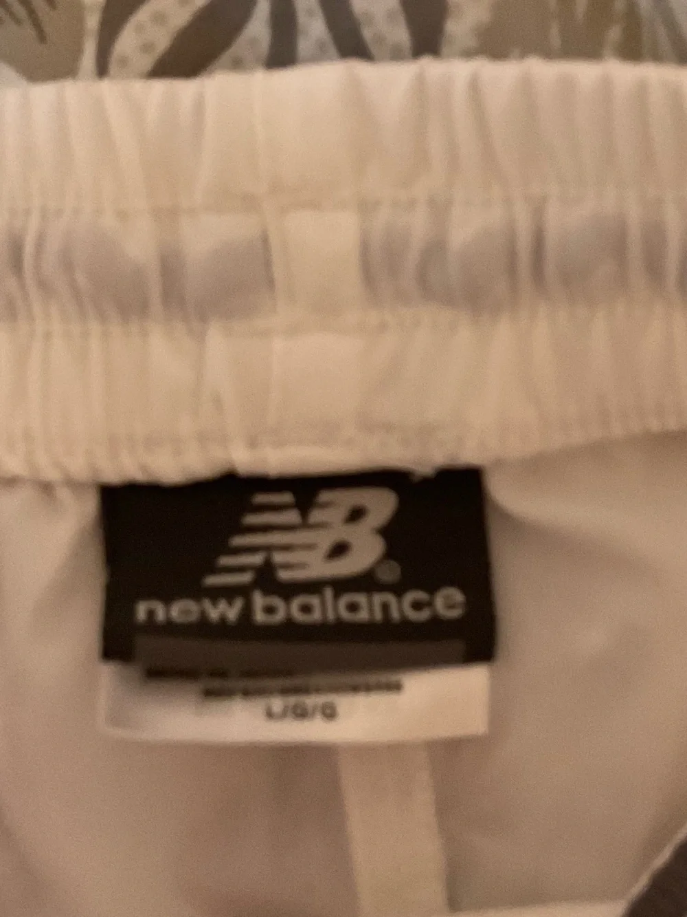 New Balance White Athletic Shorts with Black Logo Tag